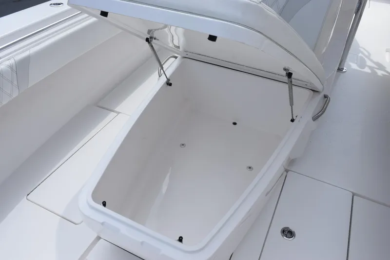 Slide: The Image of Open storage compartment on 2025 Contender 35 ST boat, showcasing spacious interior. - 27