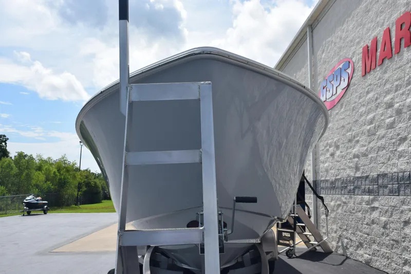 Slide: The Image of 2025 Contender 35 ST boat displayed outside a marine dealership. - 3