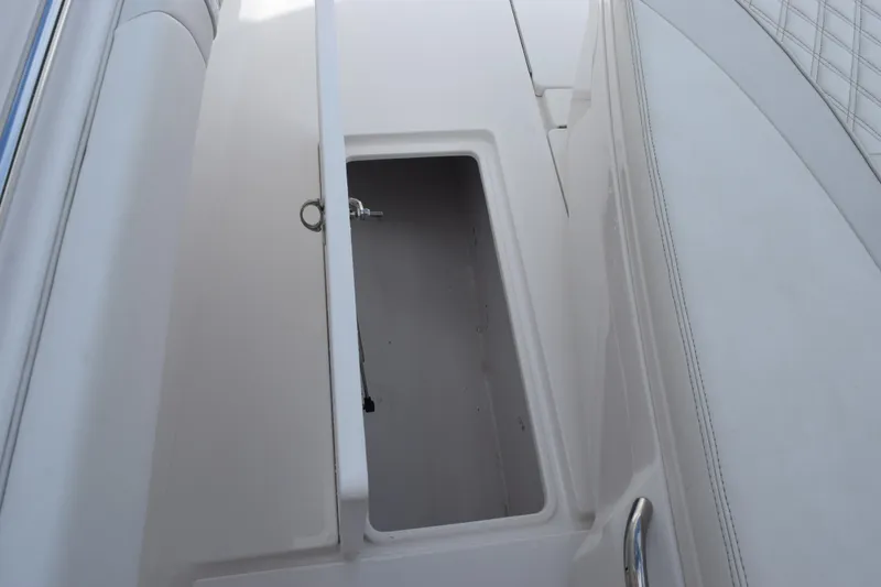 Slide: The Image of Open storage compartment on 2025 Contender 35 ST boat interior. - 30