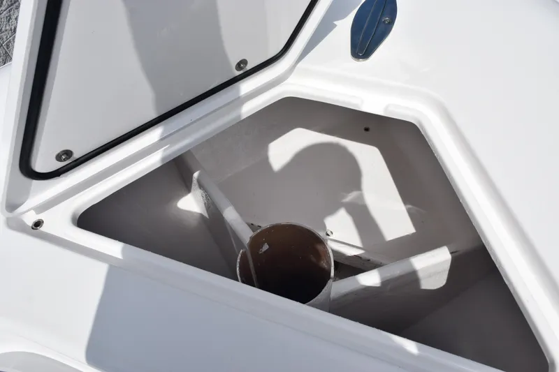 Slide: The Image of Open storage compartment on 2025 Contender 35 ST boat, showcasing interior space. - 31