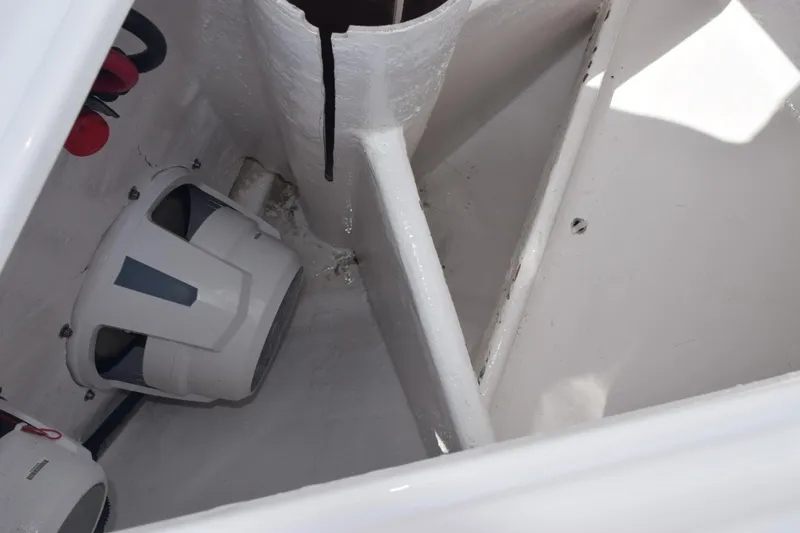 Slide: The Image of Interior view of 2025 Contender 35 ST boat, featuring white compartments and equipment. - 32