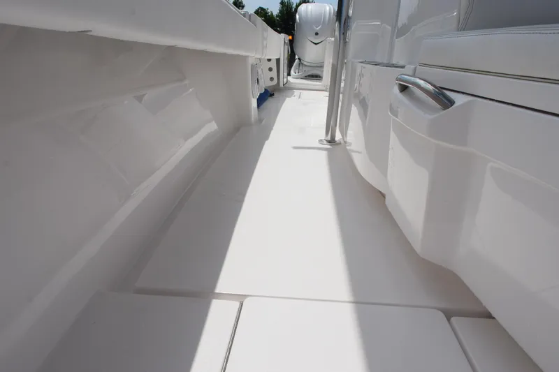 Slide: The Image of 2025 Contender 35 ST boat interior, showcasing sleek white deck and seating area. - 33