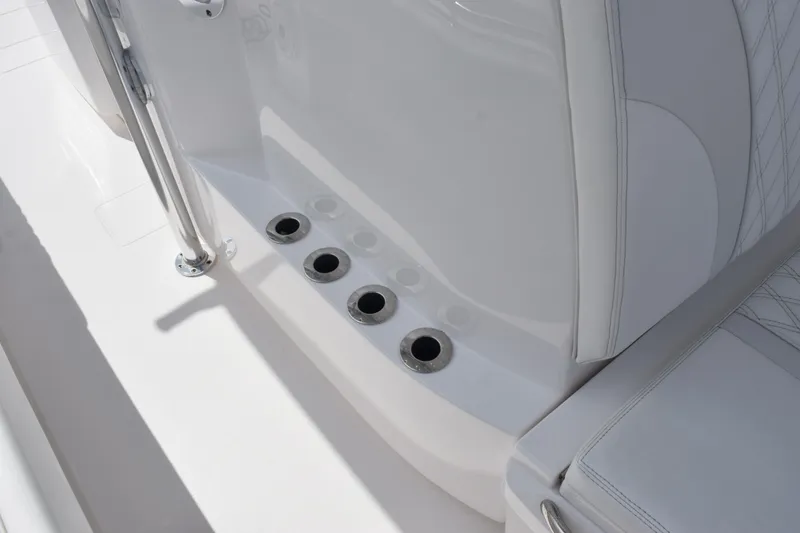 Slide: The Image of 2025 Contender 35 ST boat interior with rod holders and cushioned seating. - 35