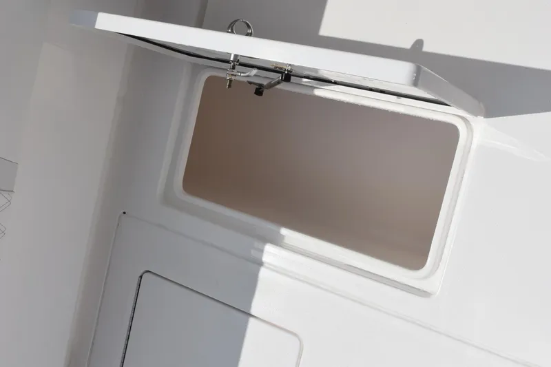 Slide: The Image of Open storage compartment on a 2025 Contender 35 ST boat. - 40