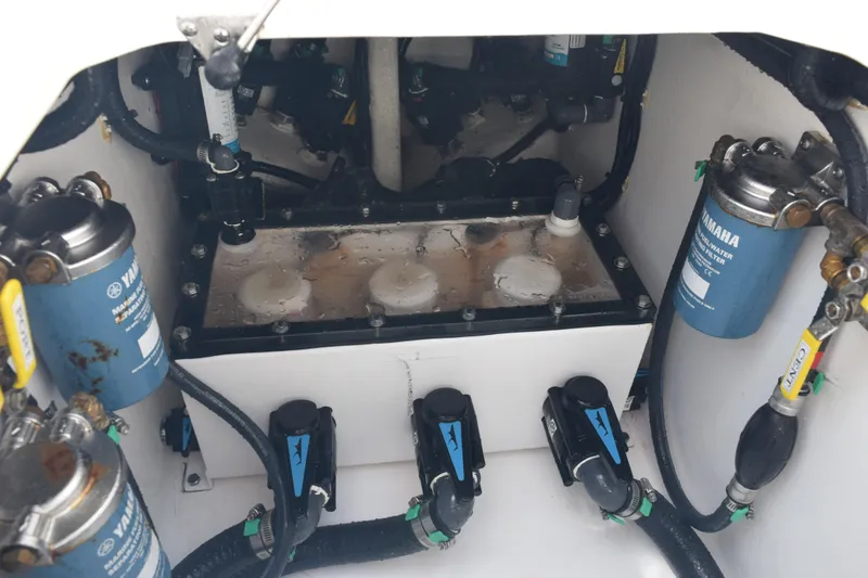 Slide: The Image of Engine compartment of 2025 Contender 35 ST with Yamaha components and filters. - 43