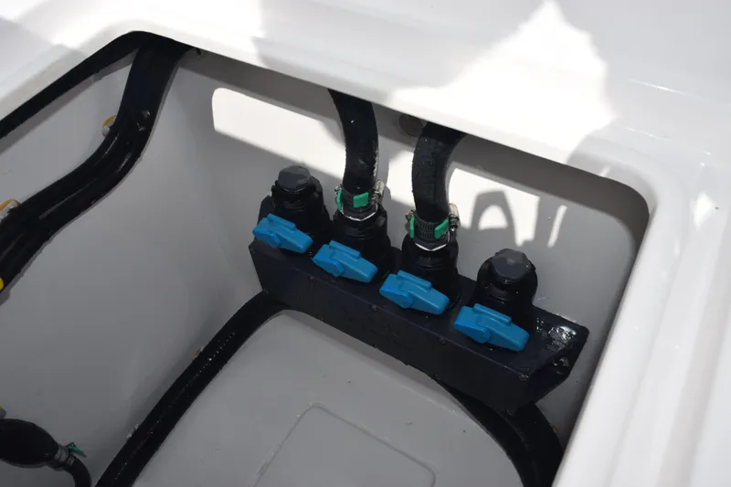 Slide: The Image of Boat plumbing system with blue valves in a 2025 Contender 35 ST. - 44