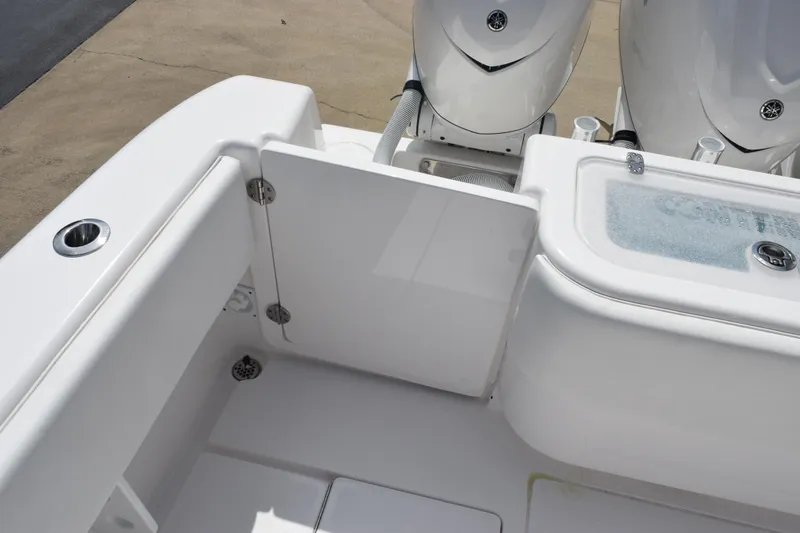 Slide: The Image of 2025 Contender 35 ST boat interior with open hatch and twin engines. - 45