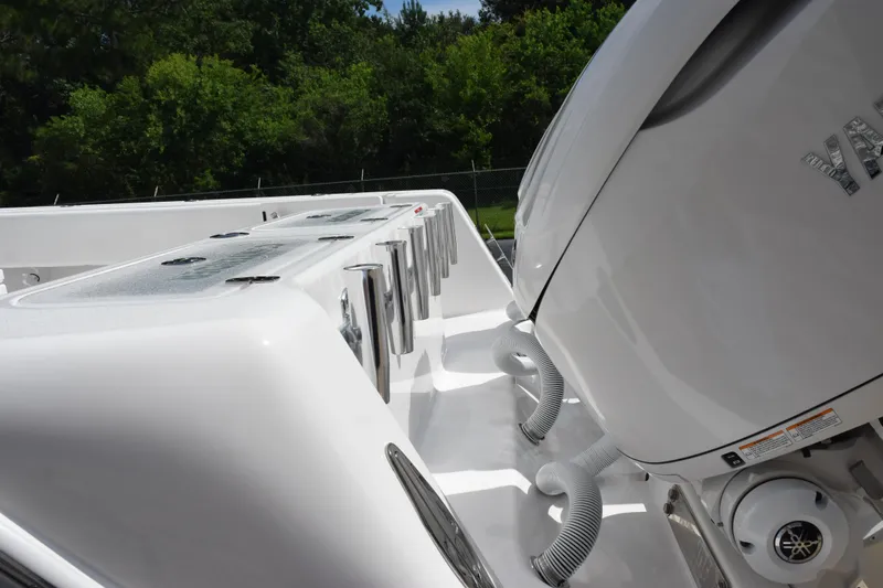 Slide: The Image of 2025 Contender 35 ST boat with powerful outboard engines and sleek design. - 7