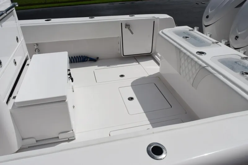 Slide: The Image of 2025 Contender 35 ST boat interior with storage compartments and seating. - 8