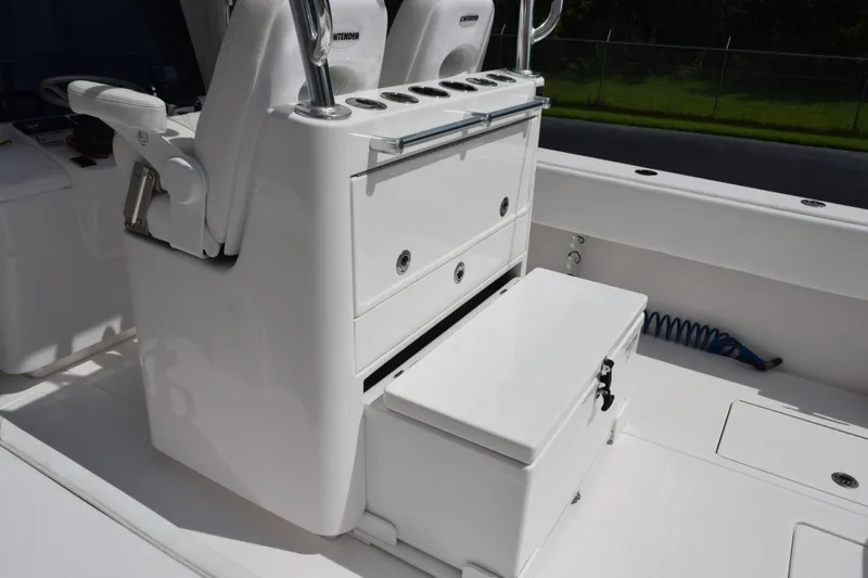 Slide: The Image of 2025 Contender 35 ST boat interior with seating and storage compartments. - 9