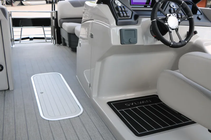 Slide: The Image of 2025 Sylvan L3 CLZ DH boat interior with modern steering and seating. - 18