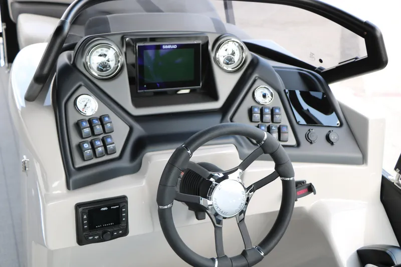 Slide: The Image of 2025 Sylvan L3 CLZ DH boat dashboard with steering wheel and control panel. - 19