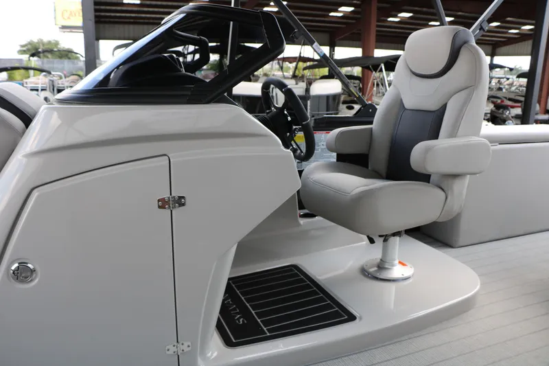 Slide: The Image of Captain's chair and helm of 2025 Sylvan L3 CLZ DH boat, featuring sleek design and modern controls. - 22