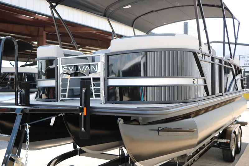 Slide: The Image of 2025 Sylvan L3 CLZ DH pontoon boat with sleek design and modern features. - 6