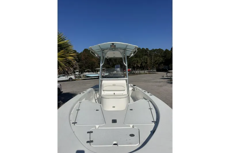 The Image of 2012 Sportsman Masters 227 Bay Boat in storage yard with RVs and containers. - 0