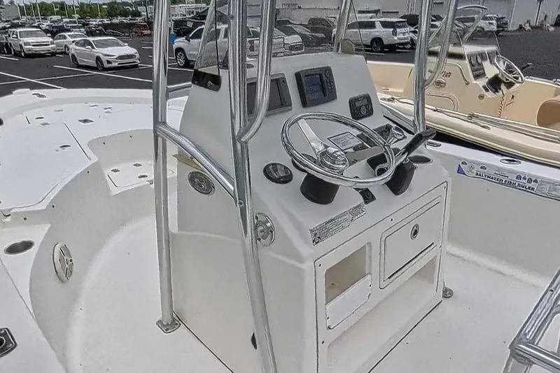Slide: The Image of 2012 Sportsman Masters 227 Bay Boat console with steering wheel and controls. - 10
