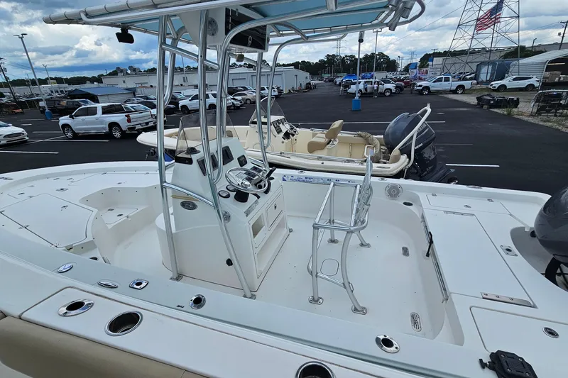 Slide: The Image of 2012 Sportsman Masters 227 Bay Boat with center console, parked in a dealership lot. - 4