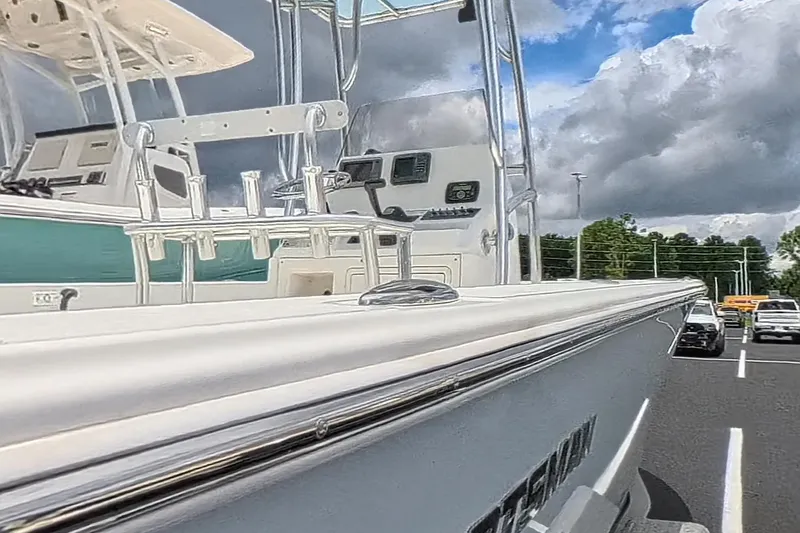 Slide: The Image of 2012 Sportsman Masters 227 Bay Boat in parking lot under cloudy sky. - 8