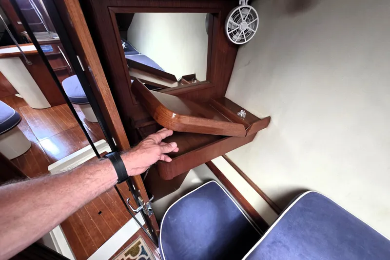 Slide: The Image of Interior of 1992 Hunter 43 Legend yacht with foldable wooden table and seating. - 16