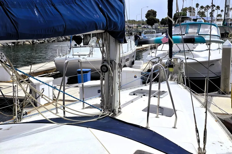 Slide: The Image of Sailboats docked at marina, featuring a 1992 Hunter 43 Legend. - 29