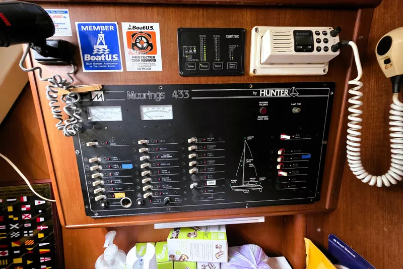 Slide: The Image of Control panel of a 1992 Hunter 43 Legend sailboat with communication equipment. - 5