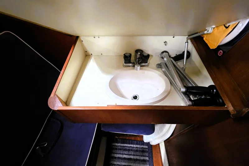 Slide: The Image of Small sink area in 1992 Hunter 43 Legend yacht interior. - 9