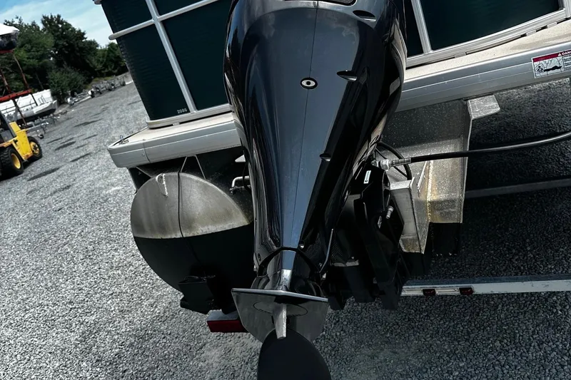 Slide: The Image of 2016 Godfrey Sweetwater 2086 Pontoon with outboard motor on gravel lot. - 13