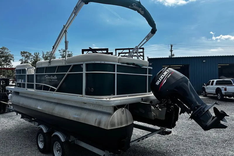 Slide: The Image of 2016 Godfrey Sweetwater 2086 Pontoon with Suzuki outboard motor on trailer. - 3
