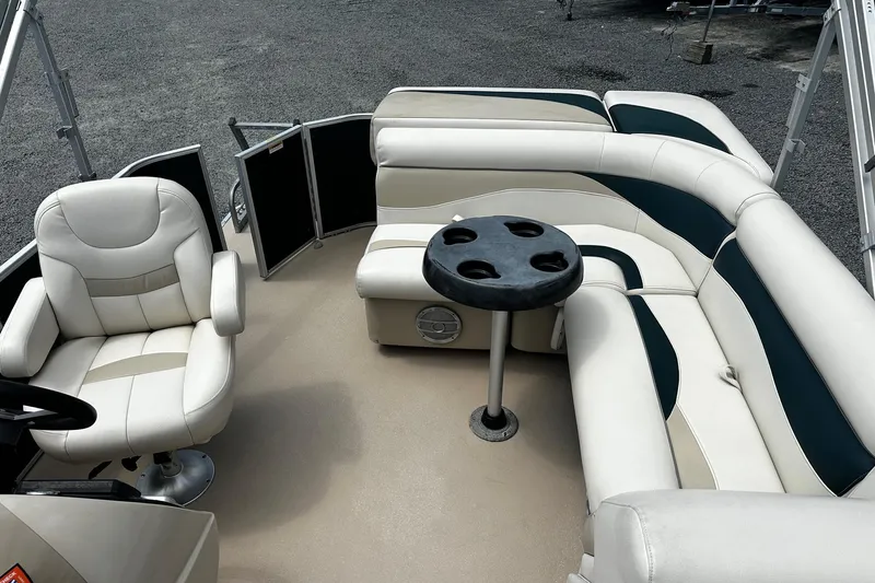 Slide: The Image of 2016 Godfrey Sweetwater 2086 Pontoon interior with plush seating and cup holder table. - 7