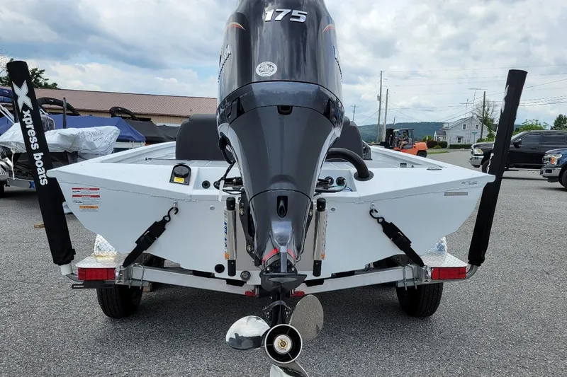 Slide: The Image of 2026 Xpress H20 Bass boat dashboard with steering wheel and control panel. - 13