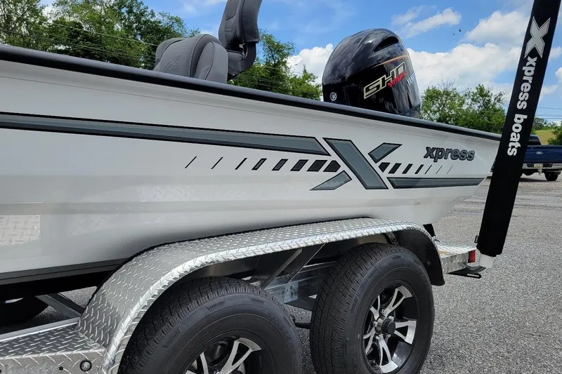 Slide: The Image of Control panel of 2026 Xpress H20 Bass boat with gauges and switches. - 14