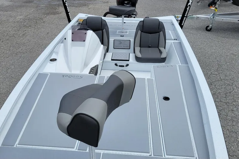 Slide: The Image of 2026 Xpress H20 Bass boat interior with steering console and seating. - 5