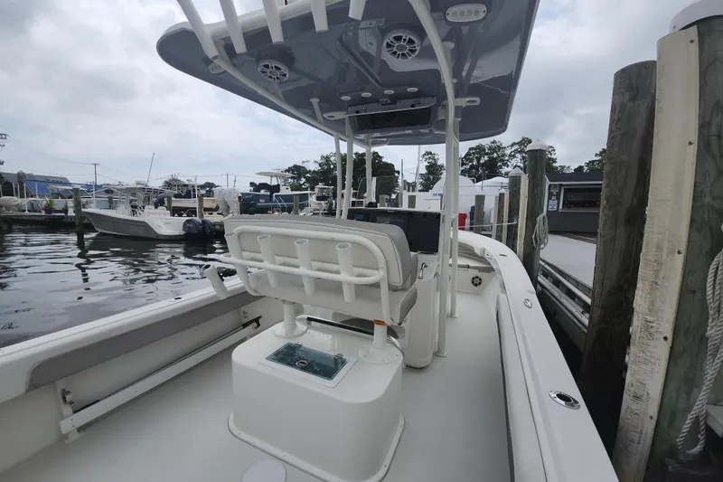 Slide: The Image of 2020 Parker 2300 Special Edition boat docked at marina, featuring sleek design and modern amenities. - 11