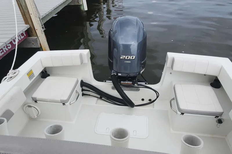 Slide: The Image of 2020 Parker 2300 Special Edition boat with Yamaha 200 engine at dock. - 14