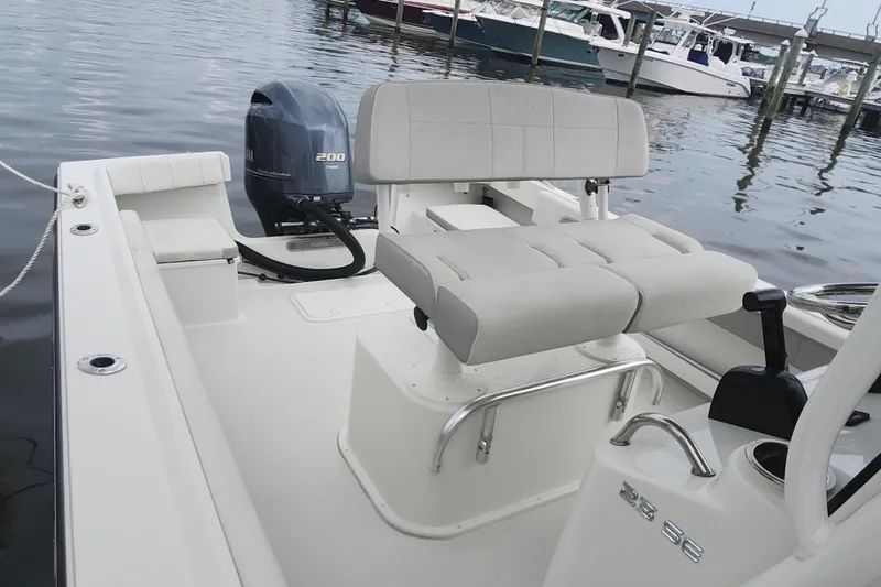 Slide: The Image of 2020 Parker 2300 Special Edition boat interior with seating and Yamaha 200 engine. - 15