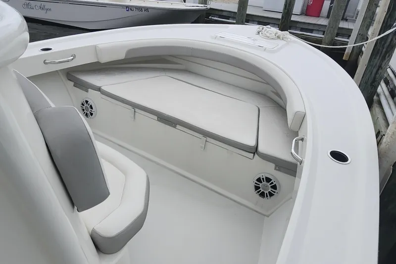 Slide: The Image of 2020 Parker 2300 Special Edition boat interior with cushioned seating and speakers. - 16