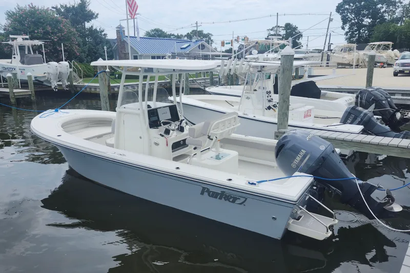 Slide: The Image of 2020 Parker 2300 Special Edition boat docked with Yamaha outboard motor. - 2