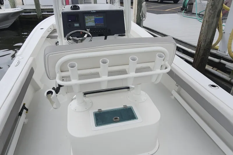 Slide: The Image of 2020 Parker 2300 Special Edition boat interior with helm, rod holders, and navigation system. - 21