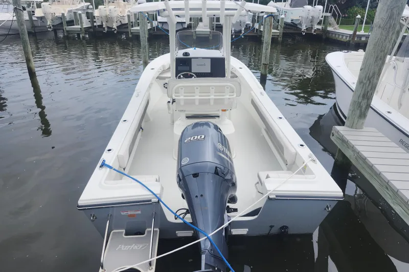Slide: The Image of 2020 Parker 2300 Special Edition boat docked, featuring a powerful outboard motor. - 3