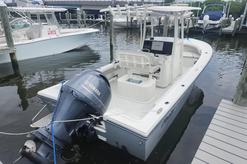 Slide: The Image of 2020 Parker 2300 Special Edition boat docked with Yamaha outboard motor. - 4