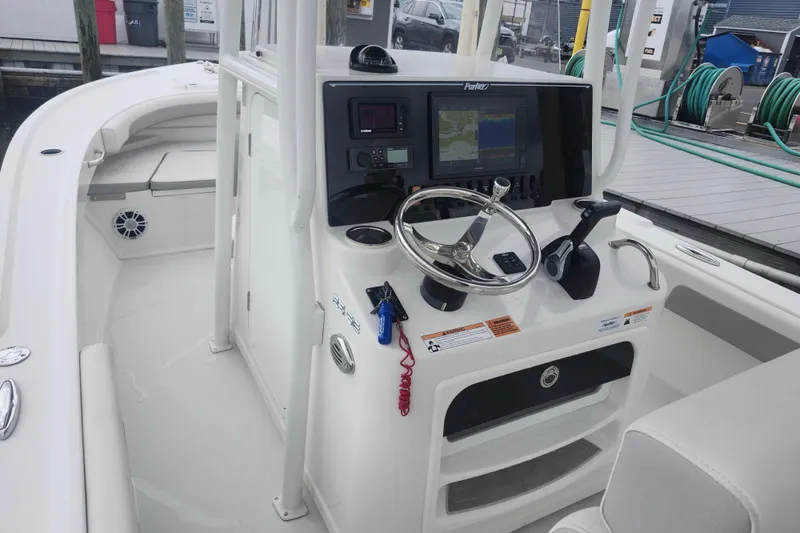 Slide: The Image of 2020 Parker 2300 Special Edition boat console with steering wheel and navigation system. - 9