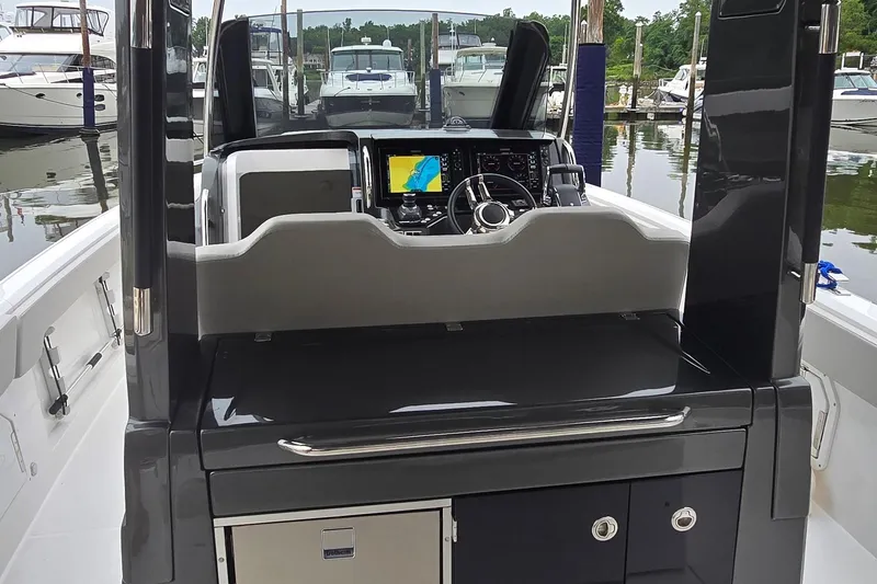 Slide: The Image of Cockpit of 2025 Schaefer V33 boat with modern navigation system and sleek design. - 14