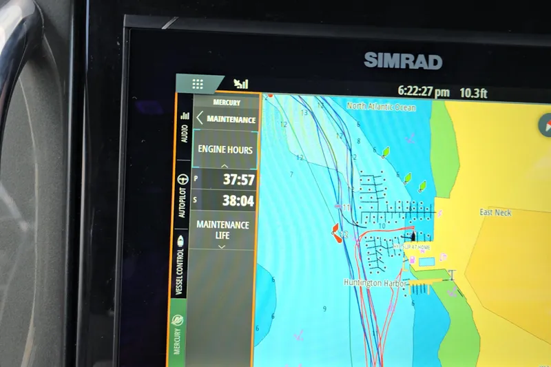 Slide: The Image of Simrad navigation display on Schaefer V33, 2025 model, showing engine hours and map. - 15