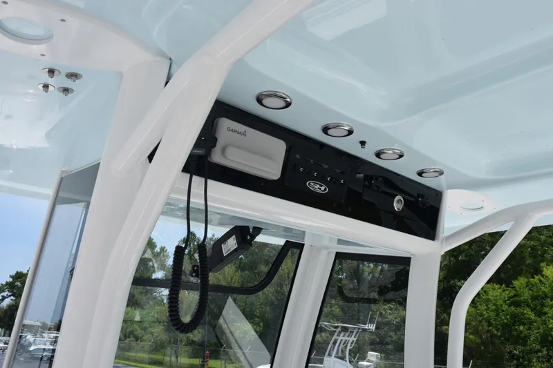 Slide: The Image of 2026 Sea Hunt Ultra 275 SE boat interior with Garmin electronics and sleek design. - 11