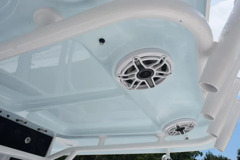 Slide: The Image of 2026 Sea Hunt Ultra 275 SE boat speakers and rod holders on the ceiling. - 18