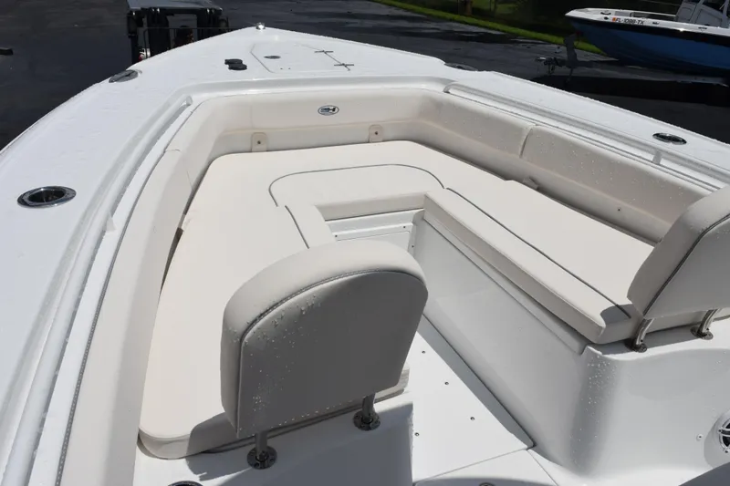 Slide: The Image of 2026 Sea Hunt Ultra 275 SE boat interior with white cushioned seating. - 19