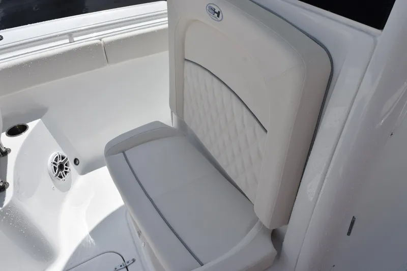Slide: The Image of 2026 Sea Hunt Ultra 275 SE boat seat with quilted design and speaker detail. - 20