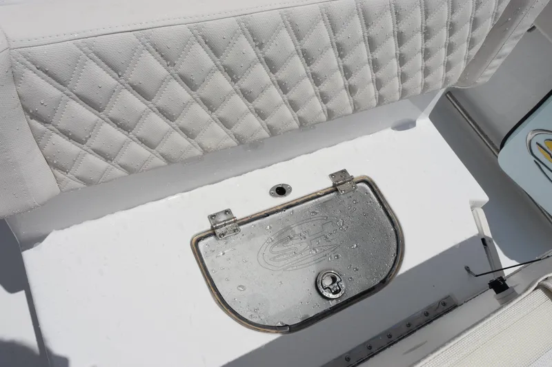Slide: The Image of 2026 Sea Hunt Ultra 275 SE boat seat with diamond-pattern upholstery and storage compartment. - 25