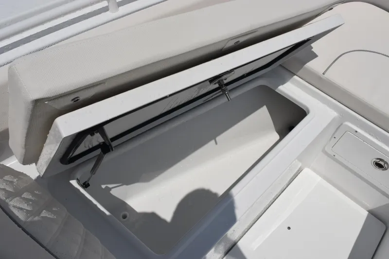 Slide: The Image of Open storage compartment on 2026 Sea Hunt Ultra 275 SE boat, showcasing interior space. - 27