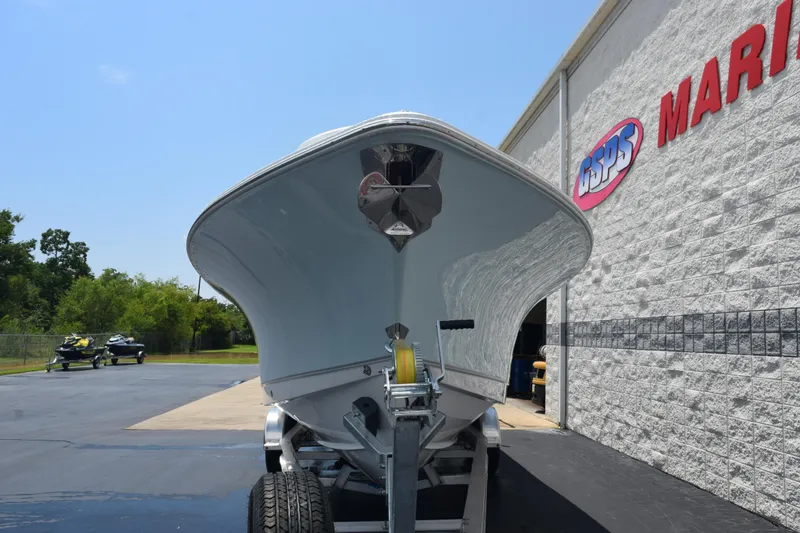 Slide: The Image of 2026 Sea Hunt Ultra 275 SE boat on trailer outside marine dealership. - 3